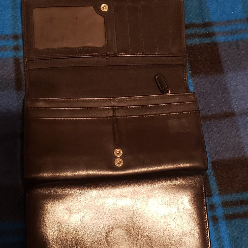 Etienne Aigner, trifold black leather wallet with checkbook carrier insert.